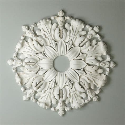Turn a flat ceiling into a focal point by installing a ceiling rose beneath your light fixture. Ceiling Roses - Plaster Design