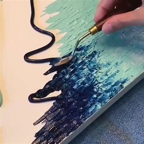 A Person Is Using A Brush To Paint An Art Piece With Acrylic Paint
