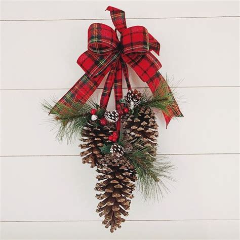 Welcome This Winter Season With This Classic Pine Cone Door Swag Made