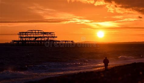 West Pier Sunset Watcher Editorial Photo Image Of Sundown 119088661