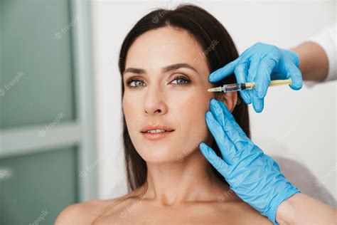 Premium Photo Portrait Of Beautiful Woman Getting Mesotherapy Treatment In Face By Specialist