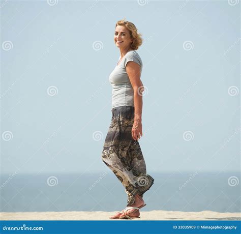Active Older Woman Dancing At The Beach Royalty Free Stock Image