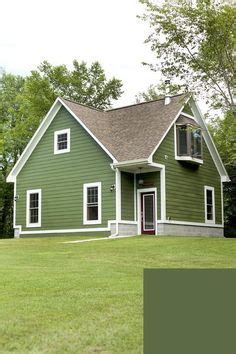 Get design inspiration for painting projects. Olive green, dark and light combo trim, garage doors with windows, beach house, exterior paint ...