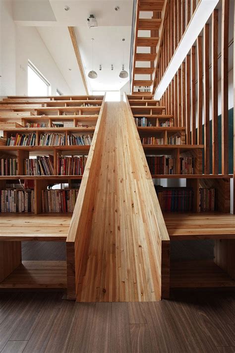 Playful Wooden Slide Formed Within A Bookshelf