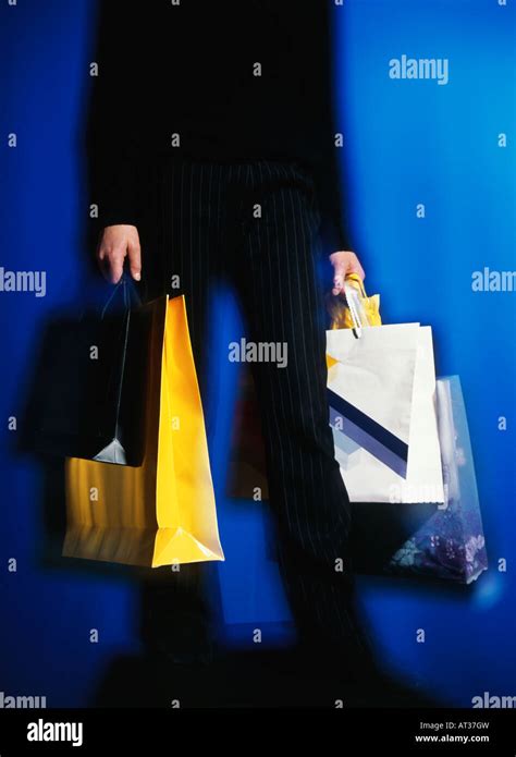 Man Carrying Lots Shopping Bags Hi Res Stock Photography And Images Alamy