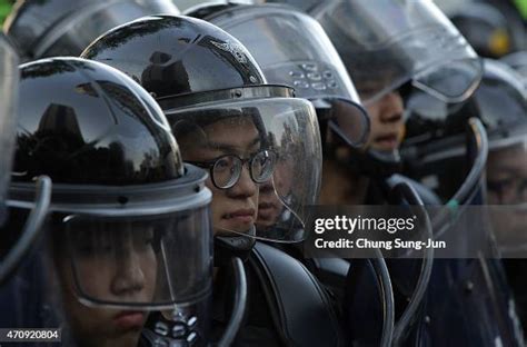 South Korean Riot Police Stand In Front Of Protesters During The