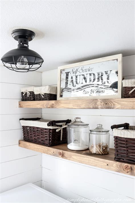 You'll apply wood glue along the ledge, put your piece of plywood in place, and secure it using a brad nailer and 1″ nails. DIY-Rustic-Farmhouse-Laundry-Room-Floating-Shelves-13