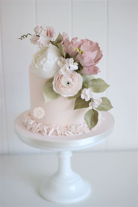 delicate single tiered sugar floral blossom wedding cake by poppy pickering in pretty blush an
