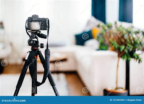 Camera On Tripod Taking Photographs Of Interior Design Furniture And