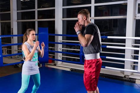 Sporty Couple Practicing Boxing In A Boxing Ring Stock Photo Image Of