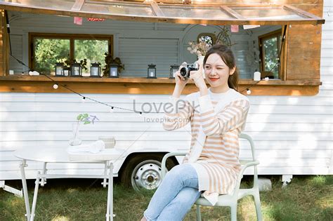 korean girl taking pictures with camera outdoors picture and hd photos free download on lovepik