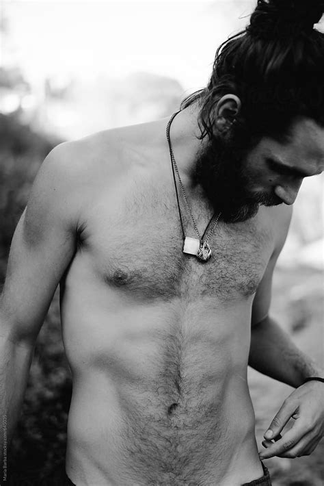 Naked Bearded Male With Necklaces Looking Down Del Colaborador De