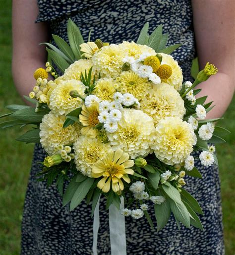 A Bouquet With Marigolds Feverfew Matricaria Zinnias Craspedia And