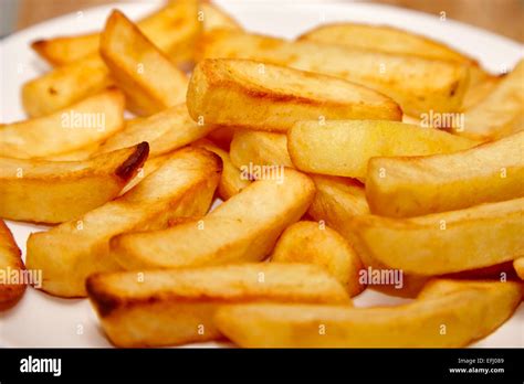 Plate Of Cooked Oven Chips Stock Photo Alamy