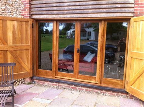 Nanawall aluminum framed sliding glass wall systems offer single track design with total customization, including the following features: Exterior. brown teak wood frame sliding patio glass door ...