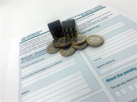 Houses, £1 sterling coins and a HMRC Stamp Duty Land Tax f…  Flickr