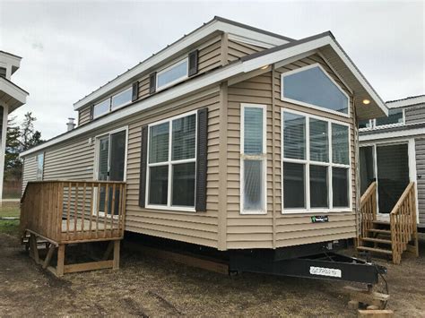 Parkmodels.com 100166 floor plan has kitchen ctop extension / loft / side patio entrance / sunken bedroom. 2020 Woodland Park 2 bed, 1.5 bath park model available ...
