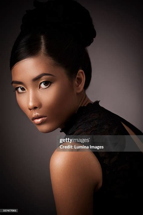 Glamorous Woman Looking Over Her Shoulder High Res Stock Photo Getty