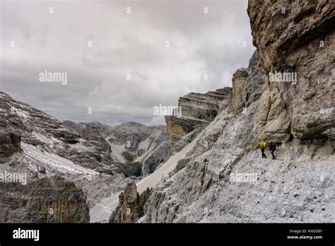 Mountain Climbers On An Exposed Via Ferrata In The South Tyrol In The