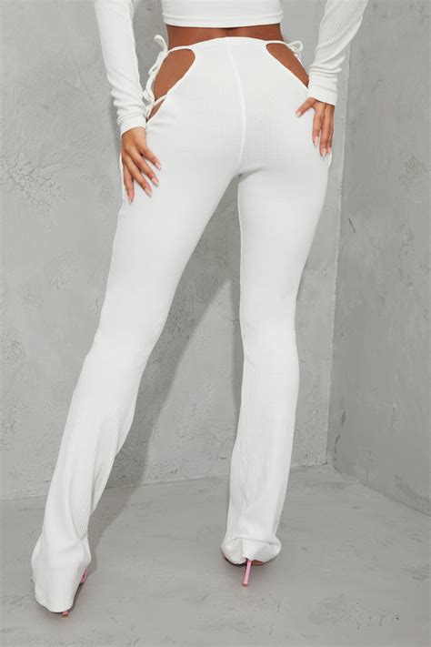 Cream Ribbed Cut Out Hip Detail Flared Trousers Prettylittlething Ksa
