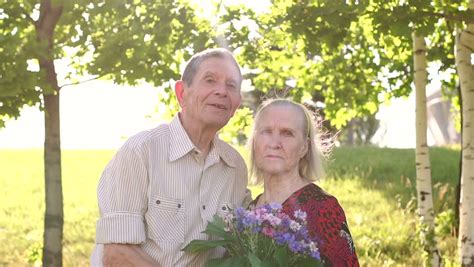 An Elderly Couple Eighty Years Walking Together In The