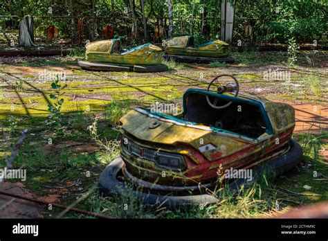 Abandoned Amusement Car Ride In Park Of Attractions In Ghost City Of