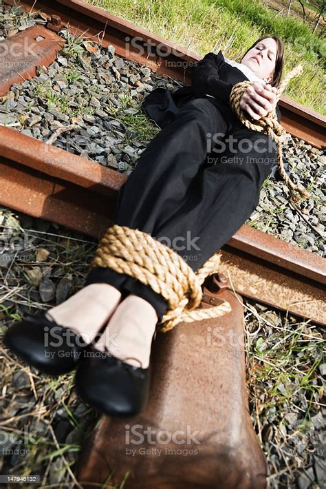 Young Businesswoman Tied To Railroad A Victim Of Workplace Harrassment