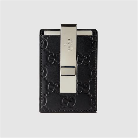 Introducing the gucci wallets for men, the signature web stripe motif can be found on key favorites as well as gucci's gg pattern embossed on its smooth and tumbled leather wallets. Lyst - Gucci Signature Money Clip in Black for Men