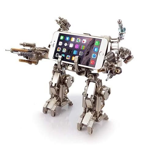 A Toy Robot Holding A Cell Phone In Its Arms