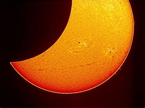 Partial Solar Eclipse With The Sun Being Shown In Alpha Hydrogen