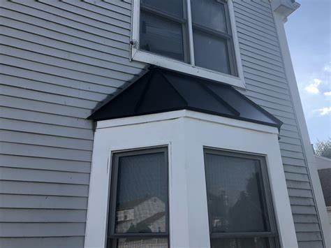 Extending Front Porch Installing Matte Black Standing Seam Metal Roof