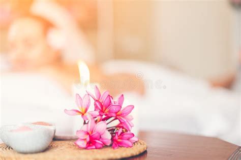 Selected Focus A Flower In Spa And Massage Room With Blurred Of Candle Light And People As A