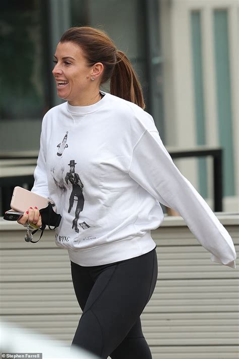 Coleen rooney watches the racing as she attends day three 'grand national day' of the randox health grand national festival at aintree racecourse on april 14, 2018 in liverpool, england. Coleen Rooney opts for a laid back look as she steps out ...