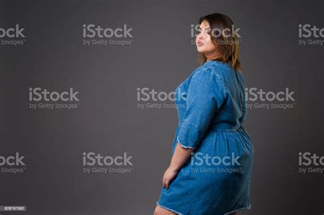 Plus Size Fashion Model In Casual Jeans Clothes Fat Woman On Gray