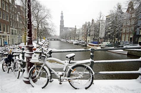 Amsterdam Covered With Snow With The Westerkerk In Netherlands Stock