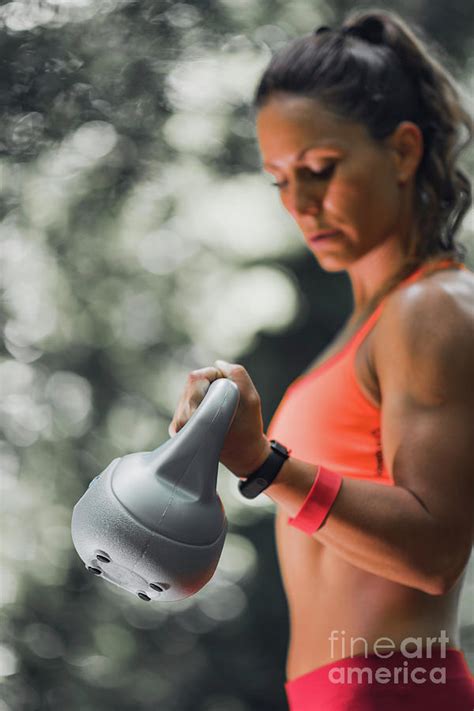Woman Exercising With Kettlebell Outdoors Photograph By Microgen Images Science Photo Library