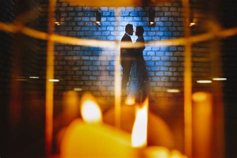 Night Time Wedding Portrait Shot Through A Lantern Using Reflections