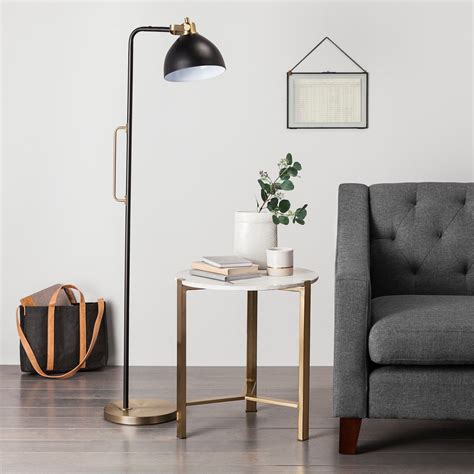 We love farmhouse lighting and floor lamps are a great option. Illuminate your space in modern style with this Black and ...