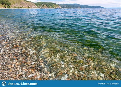 View Of The Rocky Coast With Clear Transparent Water Near The Shore Of