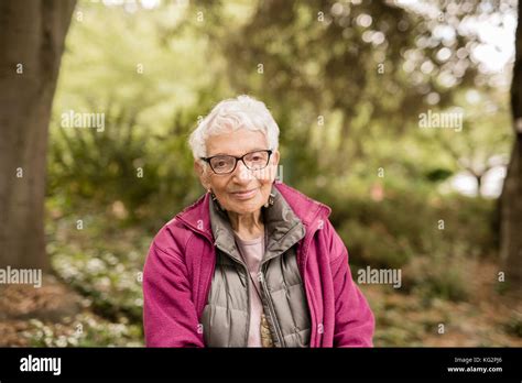 Independent Elderly Woman In The Park Stock Photo Alamy