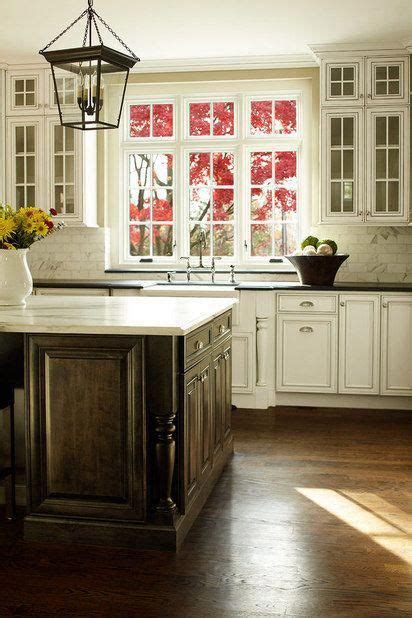 Here at our fixer upper, deciding on the perfect white quartz color was challenging in spite of knowing just. Elegant kitchen - stained wood island, white cabinets ...