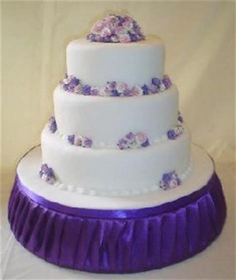 Avoid adding too much color to the cake or it will look overdone, but a. lilac abbeydale wedding cake in white with small purple ...