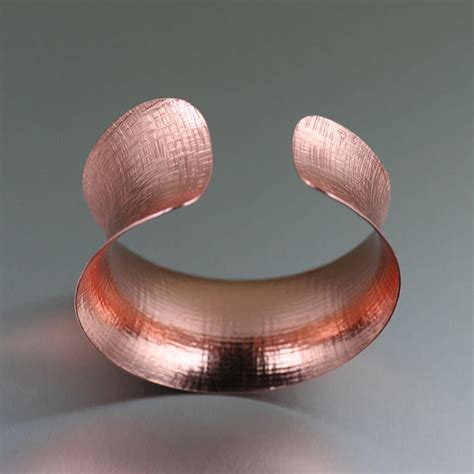 Top Anticlastic Linen Copper Bangle Presented On Johnsbrana