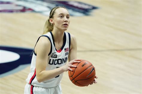 Paige bueckers twirls a pencil in her hand and stares at the blank form. UConn WBB Weekly: How Paige Bueckers stacks up to Husky greats in Geno's own words - The UConn Blog