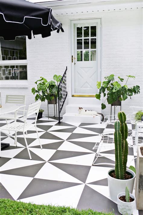 If combined with other materials in the living room or dining area patterned floor tiles can be used to form an island or focal point. Painted Patio Tile DIY - A Beautiful Mess