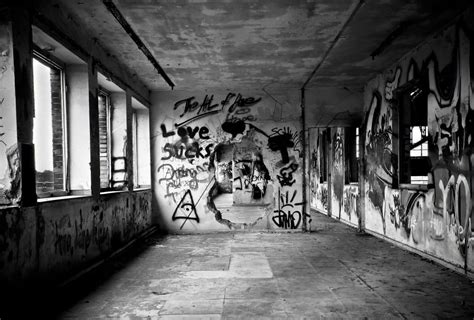 Grayscale Photo Of Concrete Abandoned Building With Wall Graffiti Free