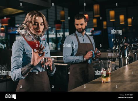 Female And Male Bartenders Working At Bar Stock Photo Alamy