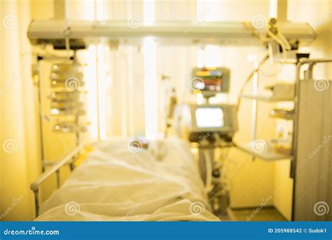 Defocused Background Of Hospital Ward With Patient Connected To The