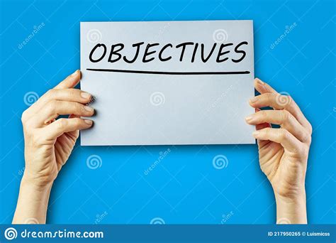 Woman S Hands Holding Cardboard With The Word Objectives Stock Image