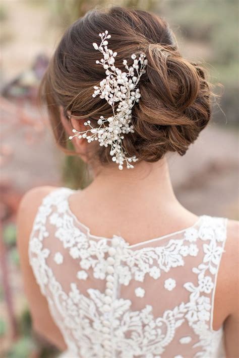 Rejuvenate the classic chignon by twisting back smaller sections and securing with a large flower for the maximum impact. 35 Romantic Wedding Updos for Medium Hair - Wedding ...